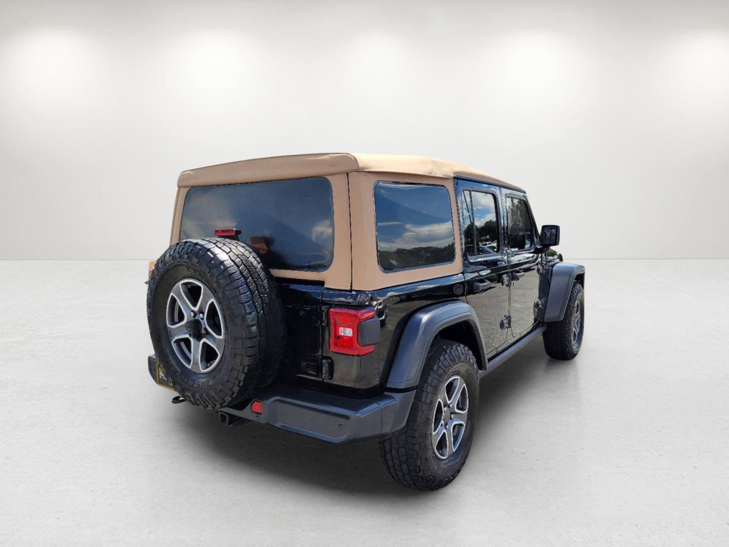 2020 Black Clearcoat /Heritage Tan/Black Jeep Wrangler Unlimited Black and Tan (1C4HJXDG9LW) with an Regular Unleaded V-6 3.6 L/220 engine, 8-Speed Automatic w/OD transmission, located at 804 22nd Ave, Phenix City, AL, 36870, (334) 297-1860, 32.484749, -85.024475 - 2020 Jeep Wrangler Unlimited Black and Tan - Photo#4