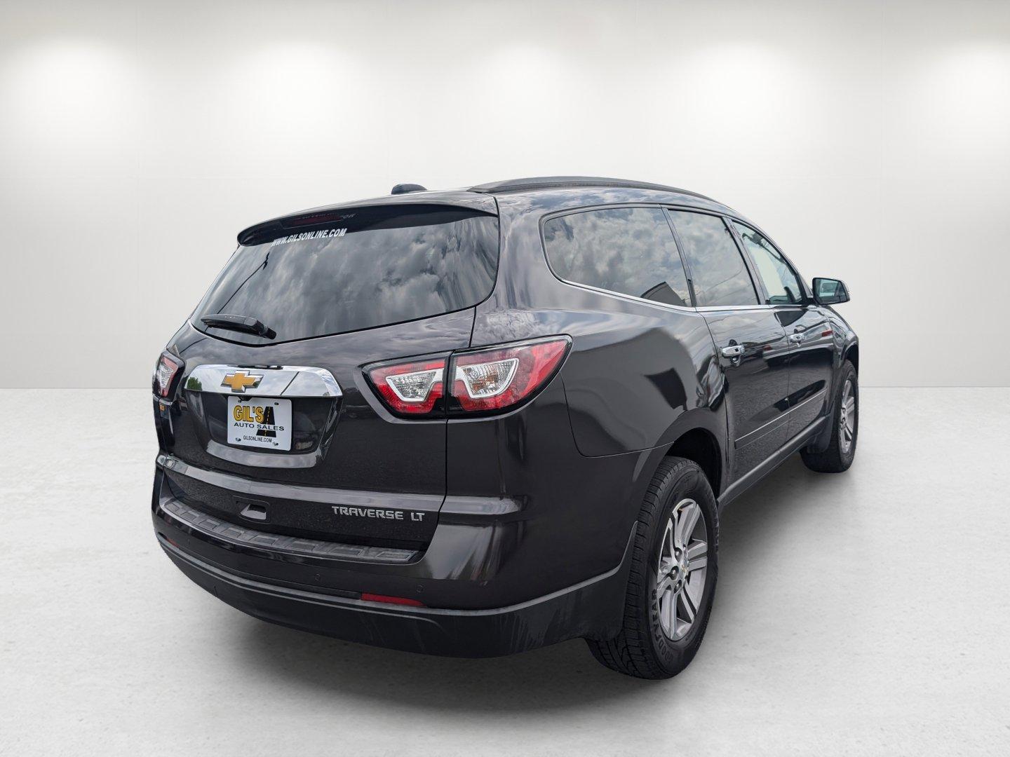 2016 /Ebony Chevrolet Traverse LT (1GNKRGKD7GJ) with an Gas V6 3.6L/217 engine, 6-Speed Automatic transmission, located at 7000 Northlake Connector, Columbus, GA, 31904, (706) 987-8085, 32.524975, -84.978134 - 2016 Chevrolet Traverse LT - Photo#4