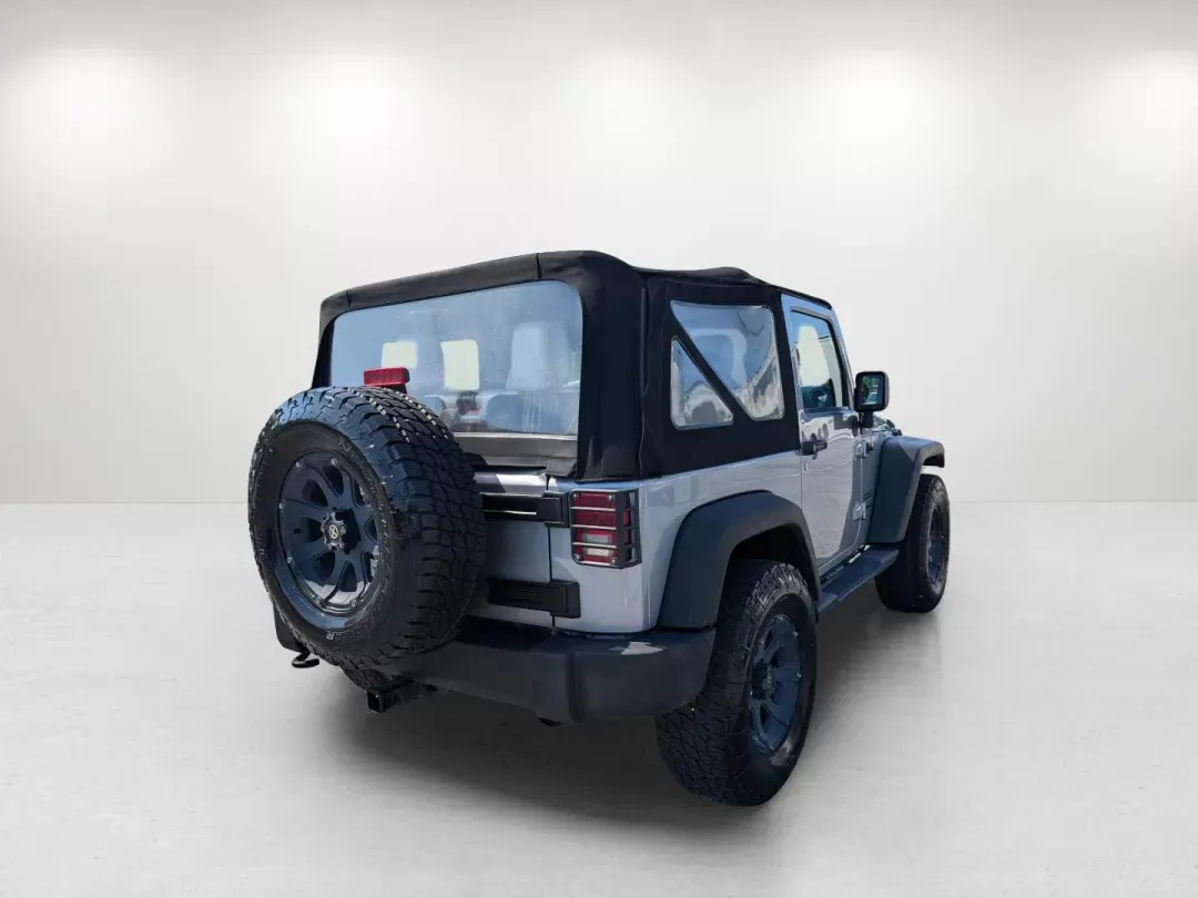 2014 /Black Jeep Wrangler Sport (1C4AJWAG7EL) with an Regular Unleaded V-6 3.6 L/220 engine, 5-Speed Automatic w/OD transmission, located at 3959 U.S. 80 W, Phenix City, AL, 36870, (334) 297-4885, 32.469296, -85.135185 - 2014 Jeep Wrangler Sport - Photo#5