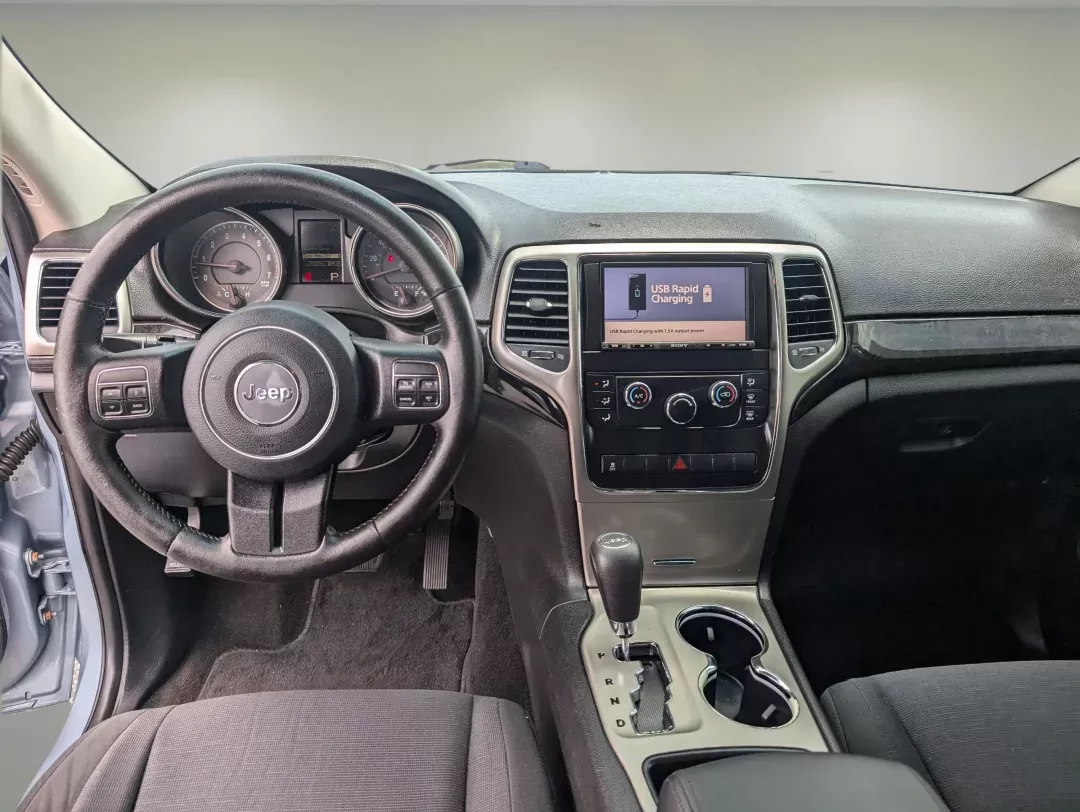 2013 /Black Jeep Grand Cherokee Laredo (1C4RJEAG2DC) with an Gas/Ethanol V6 3.6L/220 engine, 5-Speed Automatic transmission, located at 3959 U.S. 80 W, Phenix City, AL, 36870, (334) 297-4885, 32.469296, -85.135185 - 2013 Jeep Grand Cherokee Laredo - Photo#11