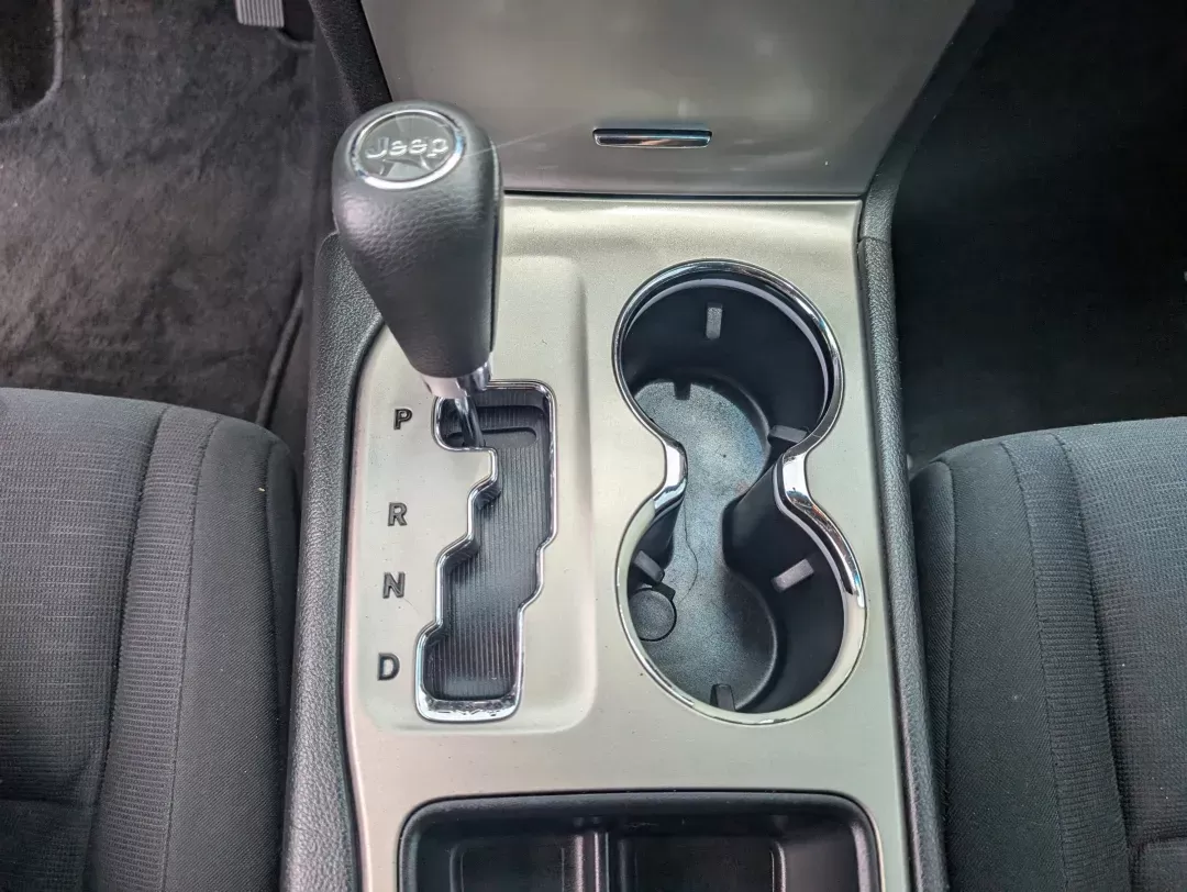 2013 /Black Jeep Grand Cherokee Laredo (1C4RJEAG2DC) with an Gas/Ethanol V6 3.6L/220 engine, 5-Speed Automatic transmission, located at 3959 U.S. 80 W, Phenix City, AL, 36870, (334) 297-4885, 32.469296, -85.135185 - 2013 Jeep Grand Cherokee Laredo - Photo#13