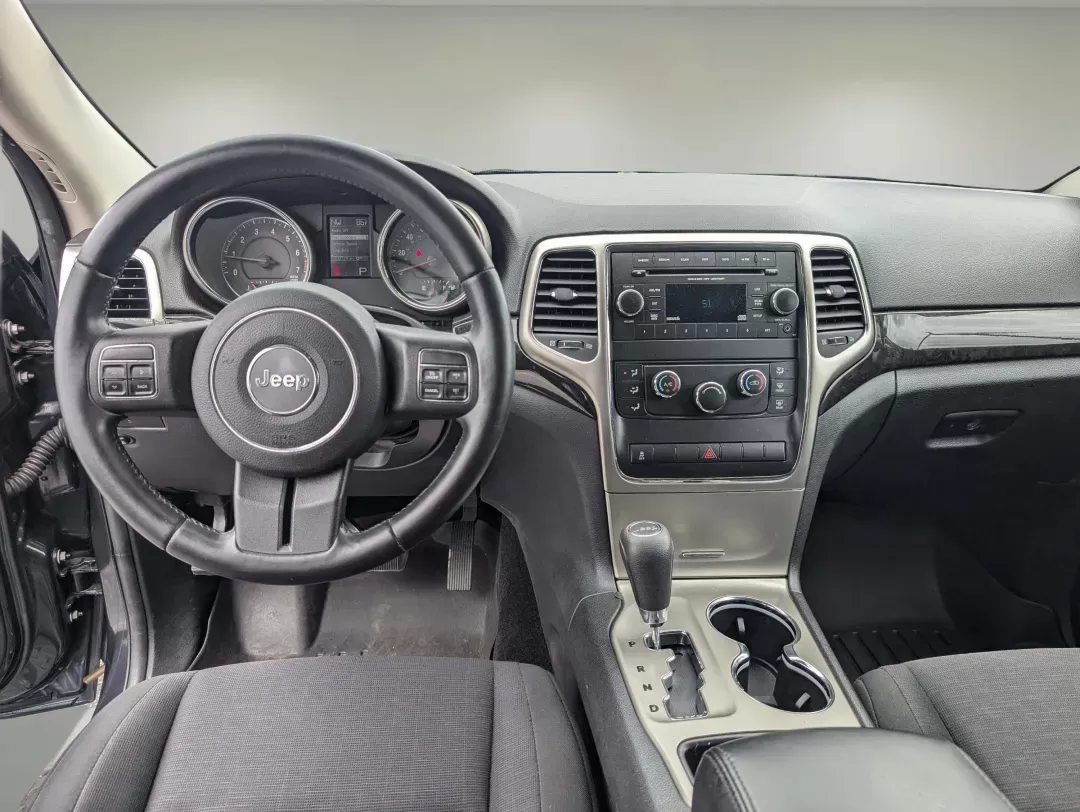 2013 /Black Jeep Grand Cherokee Laredo (1C4RJFAG6DC) with an Gas/Ethanol V6 3.6L/220 engine, 5-Speed Automatic transmission, located at 3959 U.S. 80 W, Phenix City, AL, 36870, (334) 297-4885, 32.469296, -85.135185 - 2013 Jeep Grand Cherokee Laredo - Photo#12