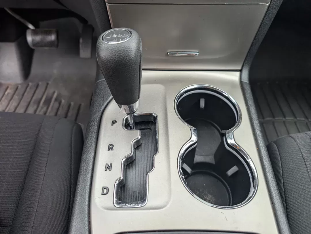 2013 /Black Jeep Grand Cherokee Laredo (1C4RJFAG6DC) with an Gas/Ethanol V6 3.6L/220 engine, 5-Speed Automatic transmission, located at 3959 U.S. 80 W, Phenix City, AL, 36870, (334) 297-4885, 32.469296, -85.135185 - 2013 Jeep Grand Cherokee Laredo - Photo#14