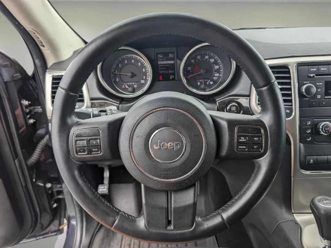 2013 /Black Jeep Grand Cherokee Laredo (1C4RJFAG6DC) with an Gas/Ethanol V6 3.6L/220 engine, 5-Speed Automatic transmission, located at 3959 U.S. 80 W, Phenix City, AL, 36870, (334) 297-4885, 32.469296, -85.135185 - 2013 Jeep Grand Cherokee Laredo - Photo#16