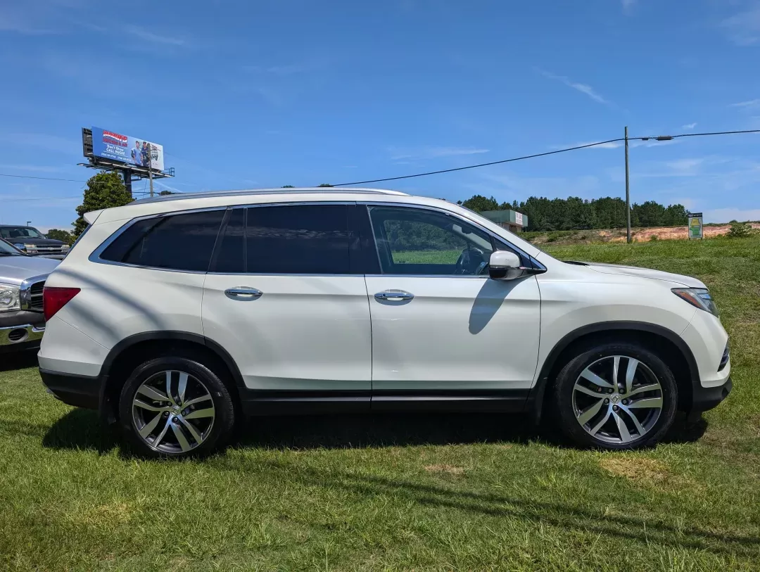 2016 Honda Pilot Elite (5FNYF6H07GB) with an Other engine, located at 3959 U.S. 80 W, Phenix City, AL, 36870, (334) 297-4885, 32.469296, -85.135185 - Elevate your family adventures with this stunning 2016 Honda Pilot Elite AWD, available now at **Gils Auto** in Phenix City, AL. Perfect for growing families or those who crave weekend getaways, this spacious SUV is designed to accommodate every journey, whether it's a trip to the grocery store or a - Photo#3