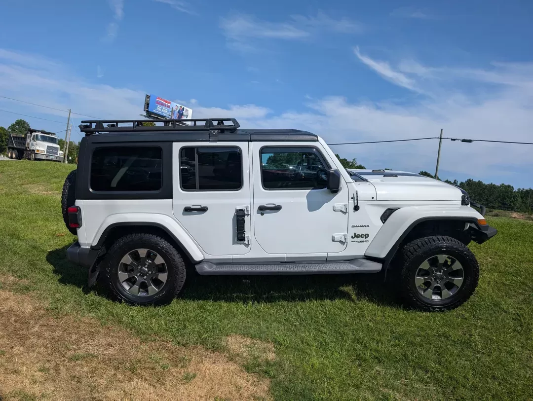 2018 /Black Jeep Wrangler Unlimited Sahara (1C4HJXEG3JW) with an Other engine, located at 3959 U.S. 80 W, Phenix City, AL, 36870, (334) 297-4885, 32.469296, -85.135185 - Adventure awaits with this stunning 2018 Jeep Wrangler Unlimited Sahara, a perfect companion for those who love the great outdoors! Whether you're navigating weekend getaways, family road trips, or simply commuting to work in style, this convertible 4WD SUV is designed to meet all your driving needs - Photo#3