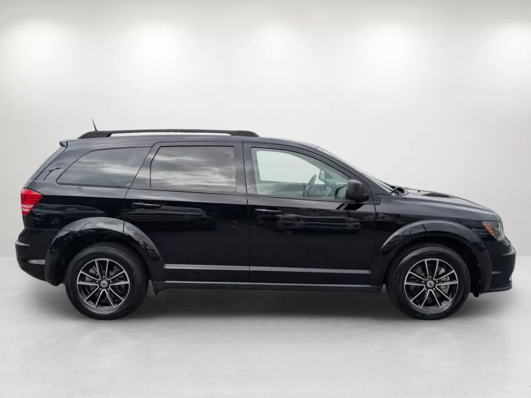 2018 /Black Dodge Journey SE (3C4PDCAB7JT) with an Other engine, located at 3959 U.S. 80 W, Phenix City, AL, 36870, (334) 297-4885, 32.469296, -85.135185 - Are you ready to elevate your family road trips or weekend adventures? Look no further than this stunning 2018 Dodge Journey SE, the perfect SUV for active lifestyles and growing families! With seats for up to seven and ample cargo space, this vehicle effortlessly blends comfort and versatility, mak - Photo#4