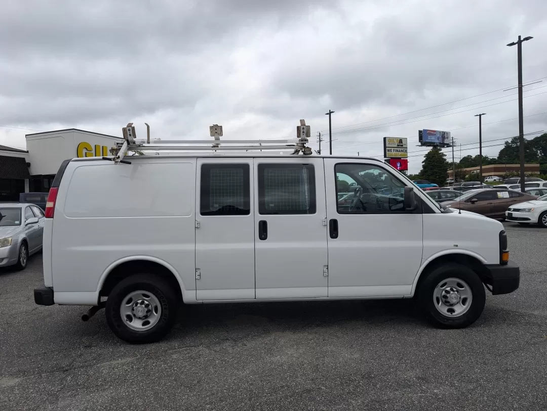 2015 /Medium Pewter Chevrolet Express Cargo Van (1GCWGFCF1F1) with an Other engine, located at 3959 U.S. 80 W, Phenix City, AL, 36870, (334) 297-4885, 32.469296, -85.135185 - Are you in the market for a reliable vehicle that can tackle tough jobs while providing you with the comfort and tech features you need? Look no further than this 2015 Chevrolet Express Cargo Van, available at Gils Auto in Phenix City, AL. This full-size cargo van is not just a vehicle; it's a versa - Photo#3