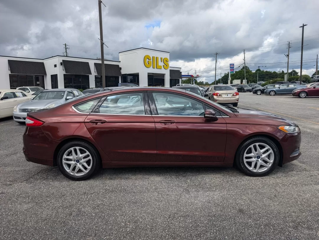 2015 Ford Fusion SE (3FA6P0H76FR) with an Other engine, located at 3959 U.S. 80 W, Phenix City, AL, 36870, (334) 297-4885, 32.469296, -85.135185 - Are you ready for a vehicle that effortlessly blends comfort, style, and practicality? Look no further than this stunning 2015 Ford Fusion SE, a versatile sedan perfect for growing families, daily commuters, or anyone seeking a reliable vehicle for weekend adventures. With a sleek copper exterior an - Photo#3