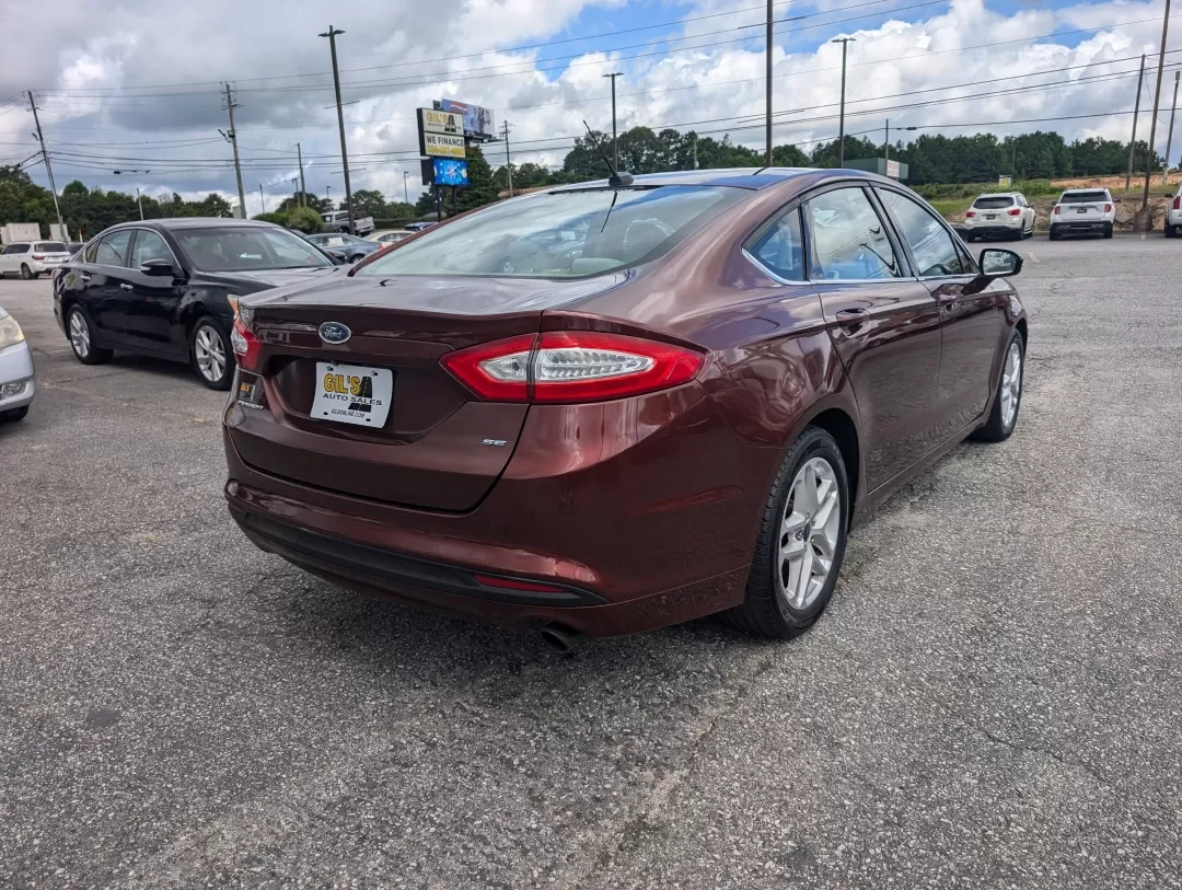 2015 Ford Fusion SE (3FA6P0H76FR) with an Other engine, located at 3959 U.S. 80 W, Phenix City, AL, 36870, (334) 297-4885, 32.469296, -85.135185 - Are you ready for a vehicle that effortlessly blends comfort, style, and practicality? Look no further than this stunning 2015 Ford Fusion SE, a versatile sedan perfect for growing families, daily commuters, or anyone seeking a reliable vehicle for weekend adventures. With a sleek copper exterior an - Photo#4