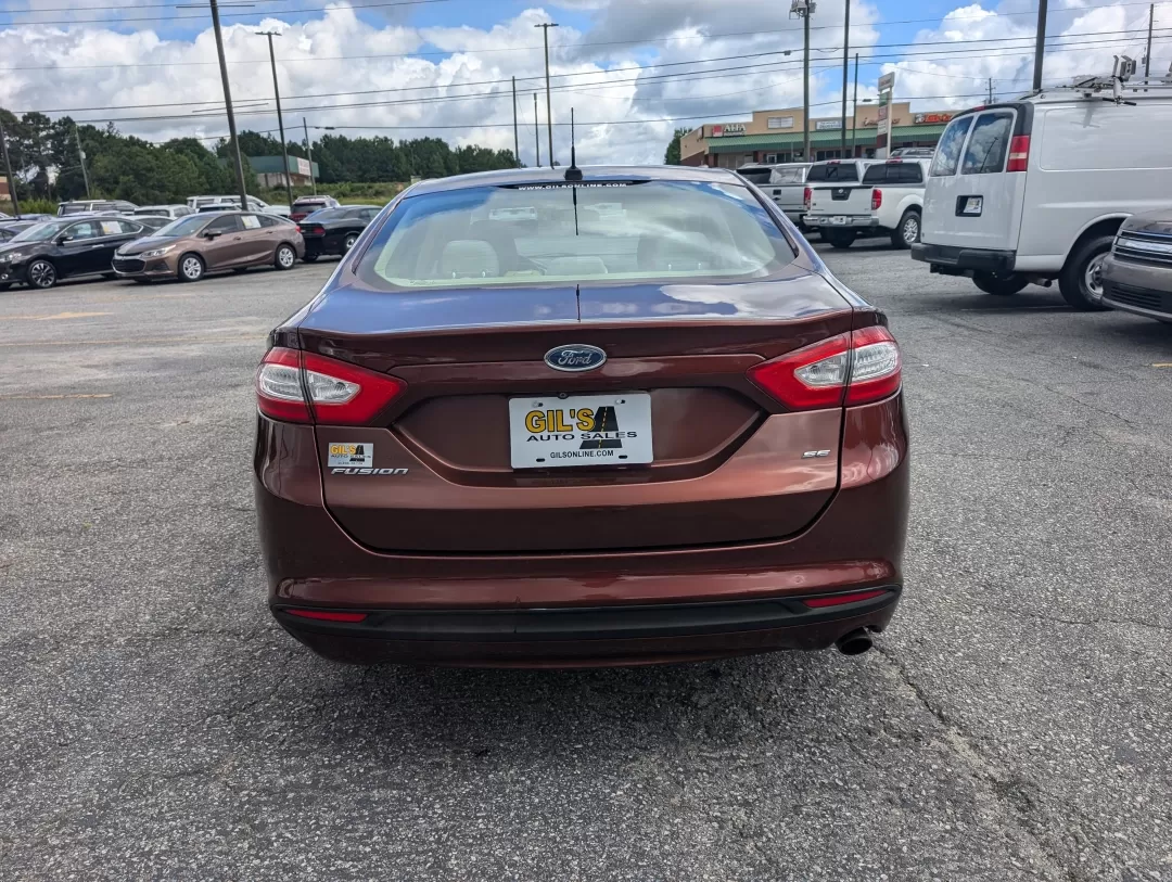 2015 Ford Fusion SE (3FA6P0H76FR) with an Other engine, located at 3959 U.S. 80 W, Phenix City, AL, 36870, (334) 297-4885, 32.469296, -85.135185 - Are you ready for a vehicle that effortlessly blends comfort, style, and practicality? Look no further than this stunning 2015 Ford Fusion SE, a versatile sedan perfect for growing families, daily commuters, or anyone seeking a reliable vehicle for weekend adventures. With a sleek copper exterior an - Photo#5