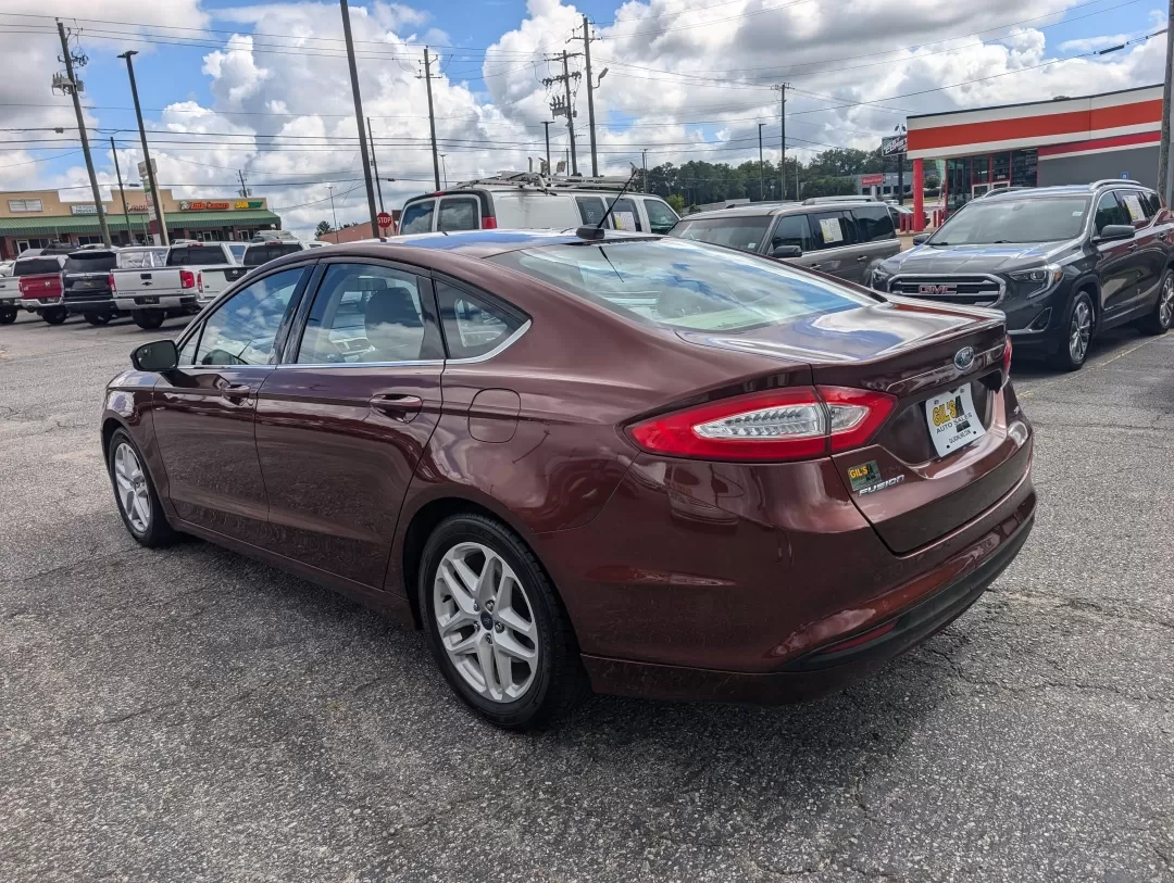 2015 Ford Fusion SE (3FA6P0H76FR) with an Other engine, located at 3959 U.S. 80 W, Phenix City, AL, 36870, (334) 297-4885, 32.469296, -85.135185 - Are you ready for a vehicle that effortlessly blends comfort, style, and practicality? Look no further than this stunning 2015 Ford Fusion SE, a versatile sedan perfect for growing families, daily commuters, or anyone seeking a reliable vehicle for weekend adventures. With a sleek copper exterior an - Photo#6