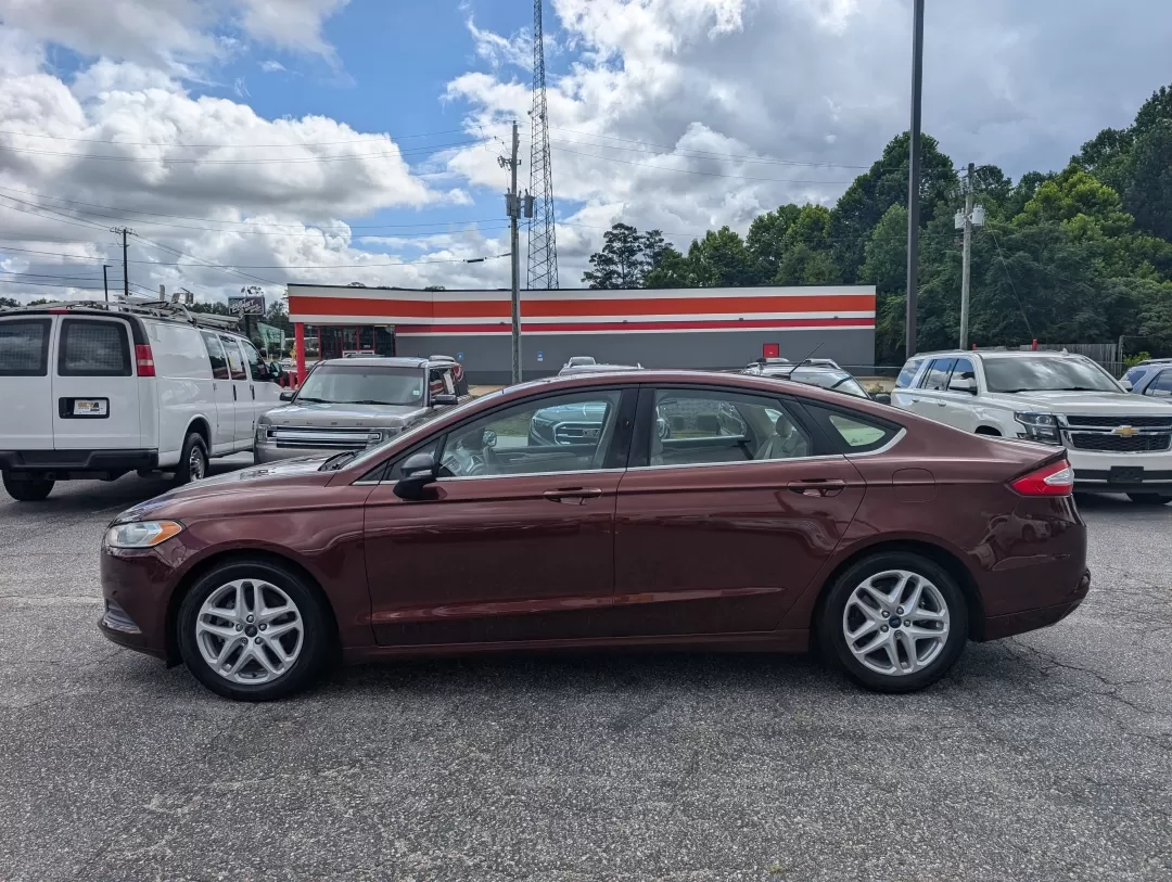 2015 Ford Fusion SE (3FA6P0H76FR) with an Other engine, located at 3959 U.S. 80 W, Phenix City, AL, 36870, (334) 297-4885, 32.469296, -85.135185 - Are you ready for a vehicle that effortlessly blends comfort, style, and practicality? Look no further than this stunning 2015 Ford Fusion SE, a versatile sedan perfect for growing families, daily commuters, or anyone seeking a reliable vehicle for weekend adventures. With a sleek copper exterior an - Photo#7