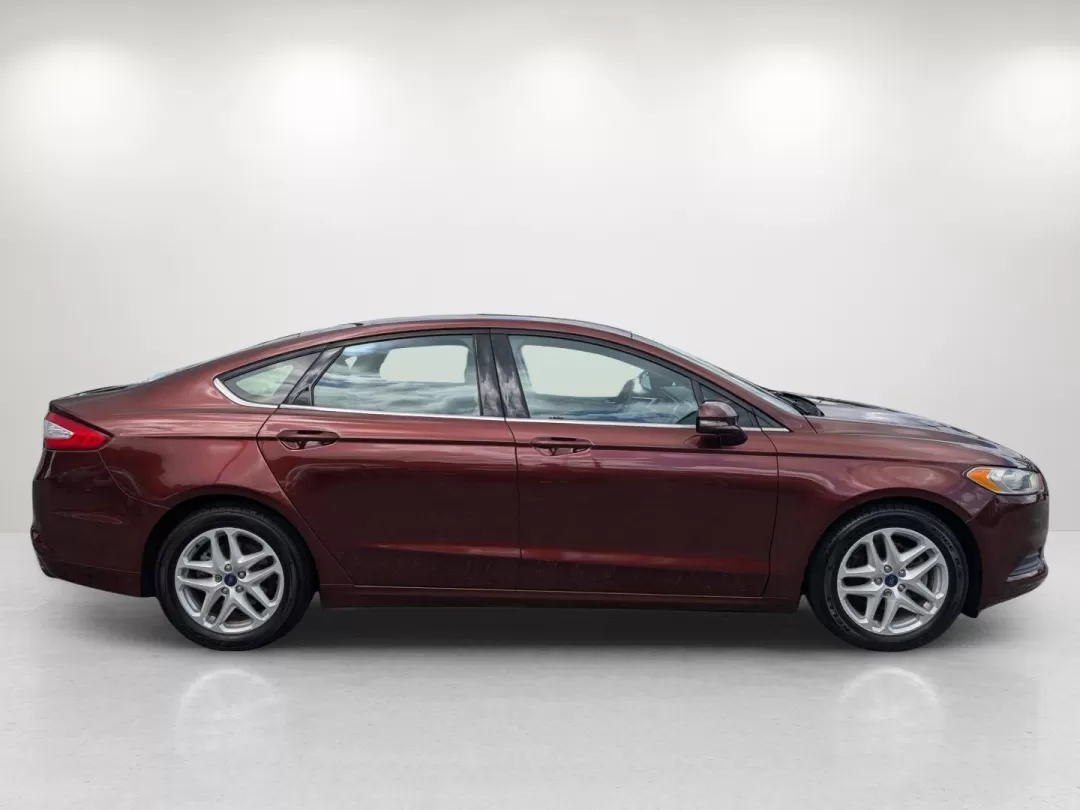 2015 Ford Fusion SE (3FA6P0H76FR) with an Other engine, located at 7000 Northlake Connector, Columbus, GA, 31904, (706) 987-8085, 32.524975, -84.978134 - Are you ready for a vehicle that effortlessly blends comfort, style, and practicality? Look no further than this stunning 2015 Ford Fusion SE, a versatile sedan perfect for growing families, daily commuters, or anyone seeking a reliable vehicle for weekend adventures. With a sleek copper exterior an - Photo#3