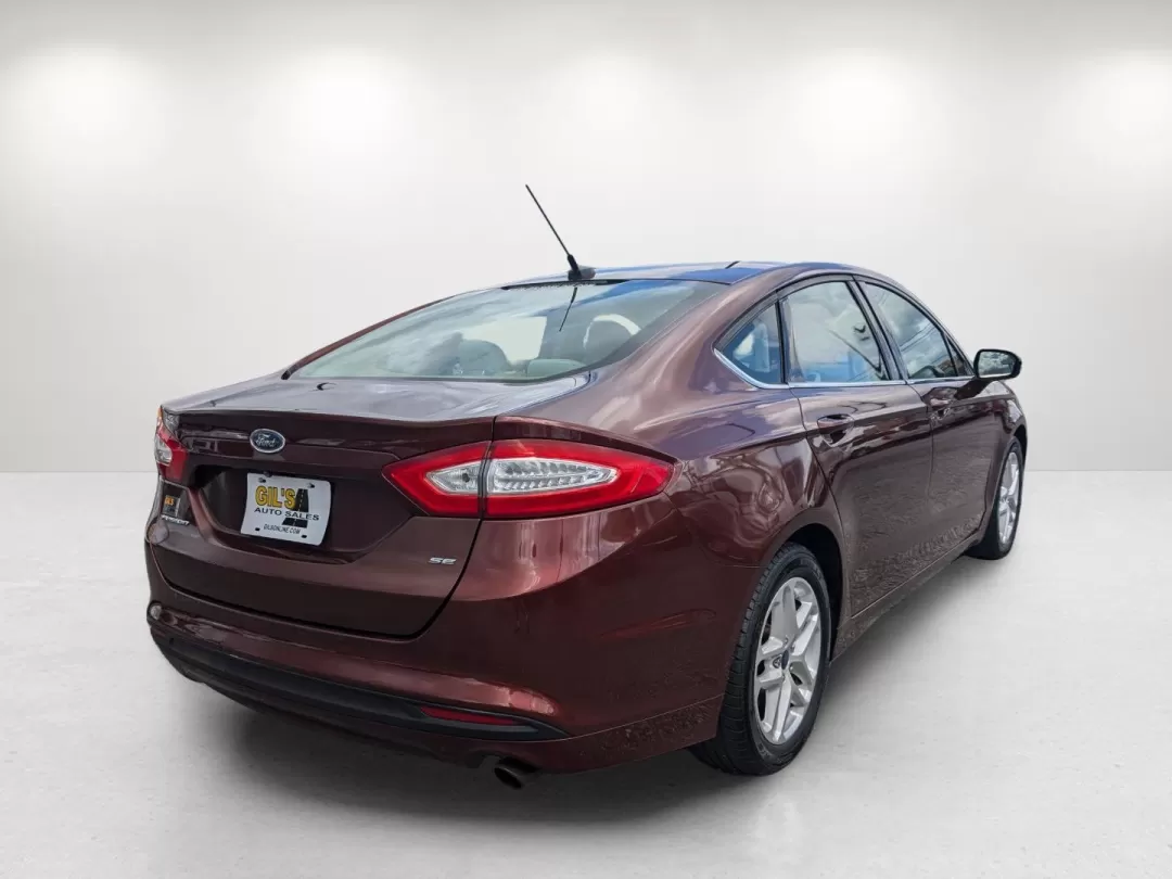 2015 Ford Fusion SE (3FA6P0H76FR) with an Other engine, located at 7000 Northlake Connector, Columbus, GA, 31904, (706) 987-8085, 32.524975, -84.978134 - Are you ready for a vehicle that effortlessly blends comfort, style, and practicality? Look no further than this stunning 2015 Ford Fusion SE, a versatile sedan perfect for growing families, daily commuters, or anyone seeking a reliable vehicle for weekend adventures. With a sleek copper exterior an - Photo#4