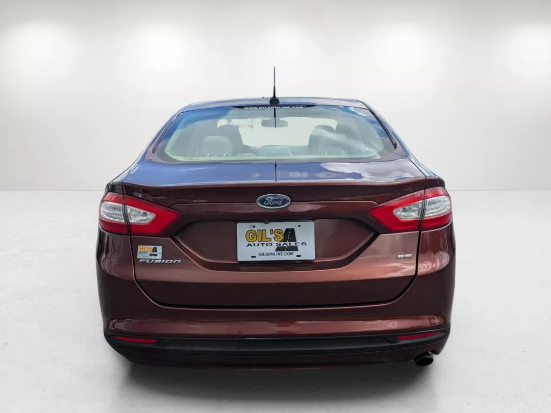2015 Ford Fusion SE (3FA6P0H76FR) with an Other engine, located at 7000 Northlake Connector, Columbus, GA, 31904, (706) 987-8085, 32.524975, -84.978134 - Are you ready for a vehicle that effortlessly blends comfort, style, and practicality? Look no further than this stunning 2015 Ford Fusion SE, a versatile sedan perfect for growing families, daily commuters, or anyone seeking a reliable vehicle for weekend adventures. With a sleek copper exterior an - Photo#5