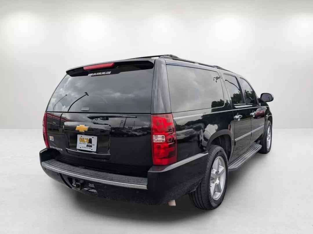 2014 /Ebony Chevrolet Suburban LTZ (1GNSCKE00ER) with an Other engine, located at 3959 U.S. 80 W, Phenix City, AL, 36870, (334) 297-4885, 32.469296, -85.135185 - Experience the ultimate in family adventure with the 2014 Chevrolet Suburban LTZ, available now at Gils Auto in Phenix City, Alabama. This spacious SUV is designed for those who seek comfort and style, making it perfect for growing families, weekend getaways, or long commutes. With ample seating for - Photo#4
