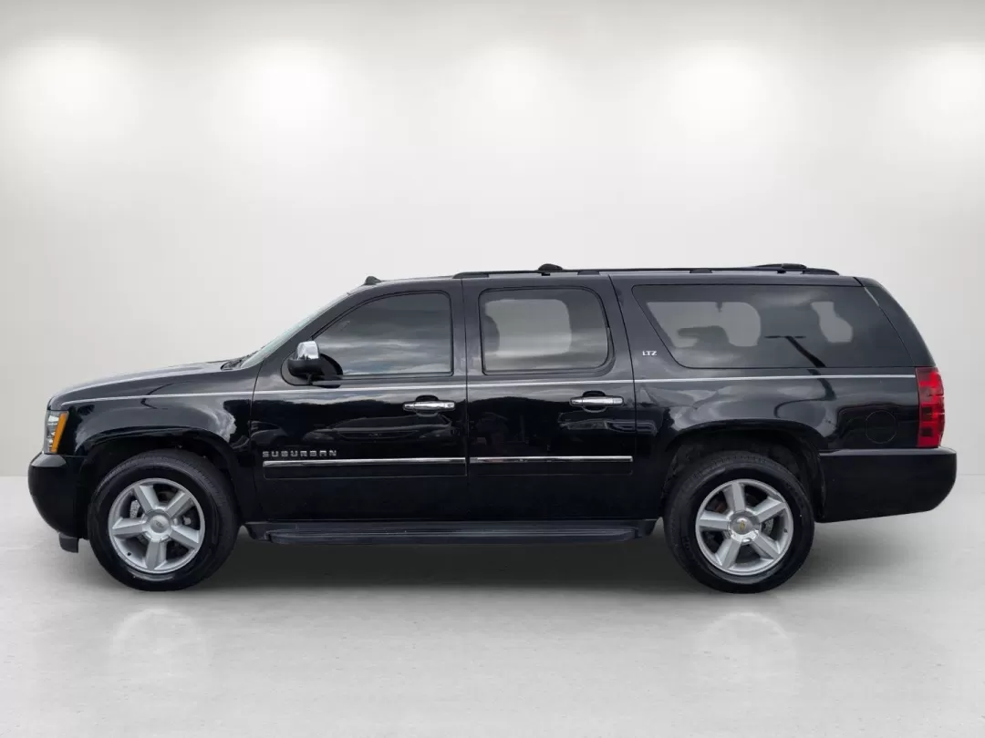 2014 /Ebony Chevrolet Suburban LTZ (1GNSCKE00ER) with an Other engine, located at 3959 U.S. 80 W, Phenix City, AL, 36870, (334) 297-4885, 32.469296, -85.135185 - Experience the ultimate in family adventure with the 2014 Chevrolet Suburban LTZ, available now at Gils Auto in Phenix City, Alabama. This spacious SUV is designed for those who seek comfort and style, making it perfect for growing families, weekend getaways, or long commutes. With ample seating for - Photo#7
