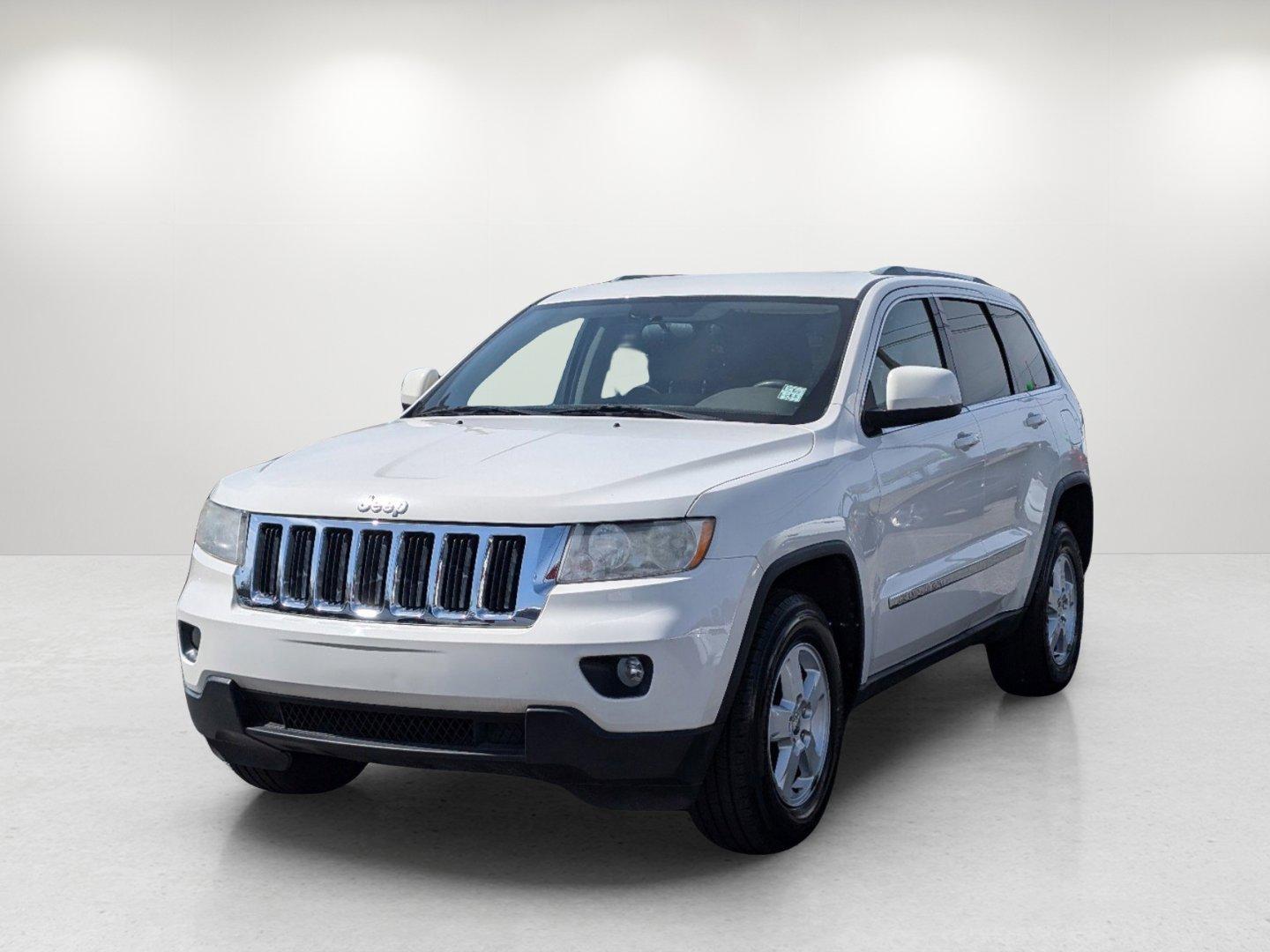 2012 Stone White /Dark Graystone/Medium Graystone Jeep Grand Cherokee Laredo (1C4RJFAG1CC) with an Gas/Ethanol V6 3.6L/220 engine, 5-Speed Automatic transmission, located at 804 22nd Ave, Phenix City, AL, 36870, (334) 297-1860, 32.484749, -85.024475 - 2012 Jeep Grand Cherokee Laredo - Photo#0