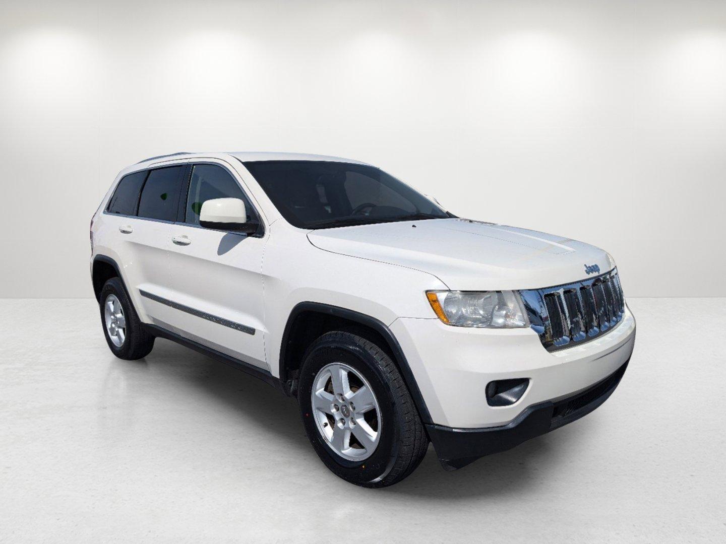 2012 Stone White /Dark Graystone/Medium Graystone Jeep Grand Cherokee Laredo (1C4RJFAG1CC) with an Gas/Ethanol V6 3.6L/220 engine, 5-Speed Automatic transmission, located at 804 22nd Ave, Phenix City, AL, 36870, (334) 297-1860, 32.484749, -85.024475 - 2012 Jeep Grand Cherokee Laredo - Photo#2