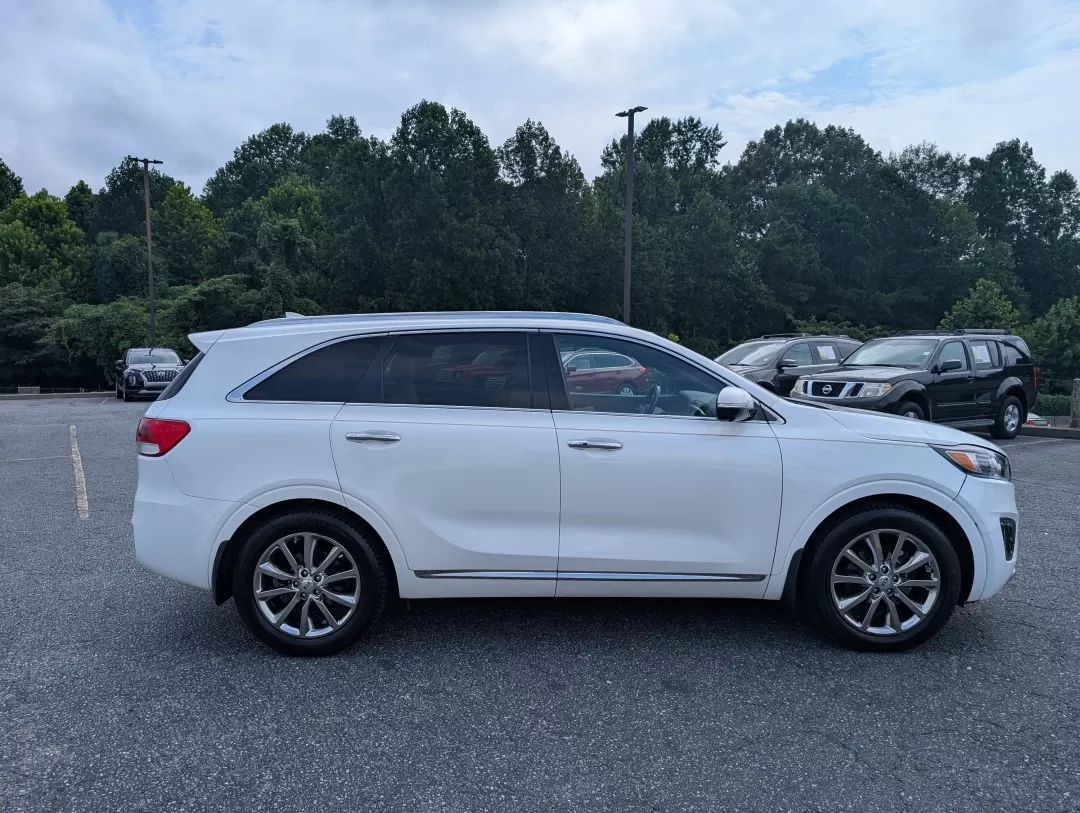 2017 /Satin Black Kia Sorento SXL V6 (5XYPK4A59HG) with an Other engine, located at 3959 U.S. 80 W, Phenix City, AL, 36870, (334) 297-4885, 32.469296, -85.135185 - Are you ready to elevate your family adventures or daily commutes with a vehicle that strikes the perfect balance between comfort, style, and reliability? Look no further than this stunning 2017 Kia Sorento SXL V6, now available at Gils Auto in Phenix City, AL. Whether you're navigating the bustling - Photo#3