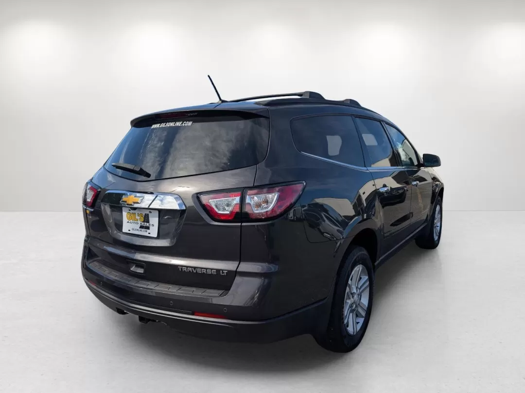 2014 /Dk Titanium/Lt Titanium Chevrolet Traverse LT (1GNKRGKD1EJ) with an Other engine, located at 804 22nd Ave, Phenix City, AL, 36870, (334) 297-1860, 32.484749, -85.024475 - Are you searching for the perfect family SUV that combines comfort, reliability, and affordability? Look no further than this stunning 2014 Chevrolet Traverse LT, now available at Gils Auto in Phenix City, AL. Ideal for growing families or anyone who enjoys weekend adventures, this versatile vehicle - Photo#4