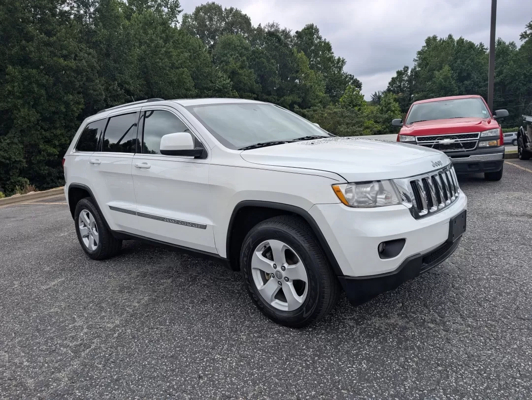 2013 /Black Jeep Grand Cherokee Laredo (1C4RJFAG6DC) with an Other engine, located at 3959 U.S. 80 W, Phenix City, AL, 36870, (334) 297-4885, 32.469296, -85.135185 - **Experience Adventure with the 2013 Jeep Grand Cherokee Laredo at Gils Auto!**<br /> <br /> Are you ready to elevate your adventures with a vehicle that can handle everything life throws your way? Look no further than the 2013 Jeep Grand Cherokee Laredo, available now at Gils Auto in Phenix City, A - Photo#2