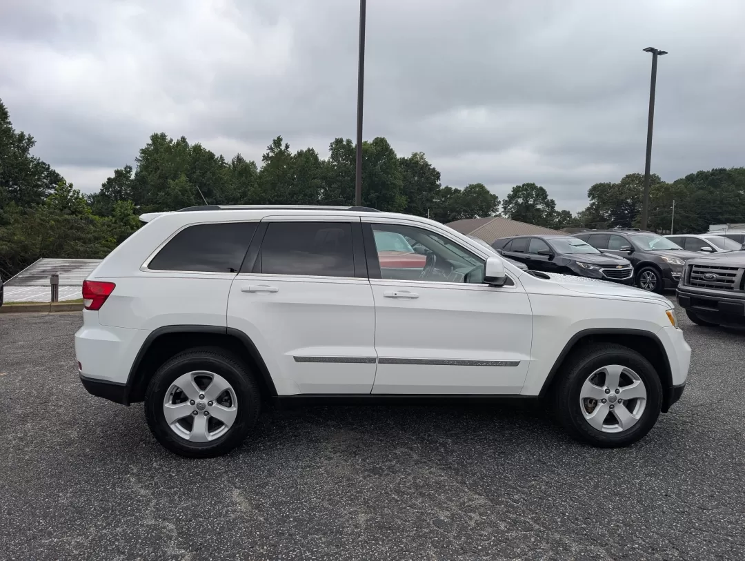 2013 /Black Jeep Grand Cherokee Laredo (1C4RJFAG6DC) with an Other engine, located at 3959 U.S. 80 W, Phenix City, AL, 36870, (334) 297-4885, 32.469296, -85.135185 - **Experience Adventure with the 2013 Jeep Grand Cherokee Laredo at Gils Auto!**<br /> <br /> Are you ready to elevate your adventures with a vehicle that can handle everything life throws your way? Look no further than the 2013 Jeep Grand Cherokee Laredo, available now at Gils Auto in Phenix City, A - Photo#3