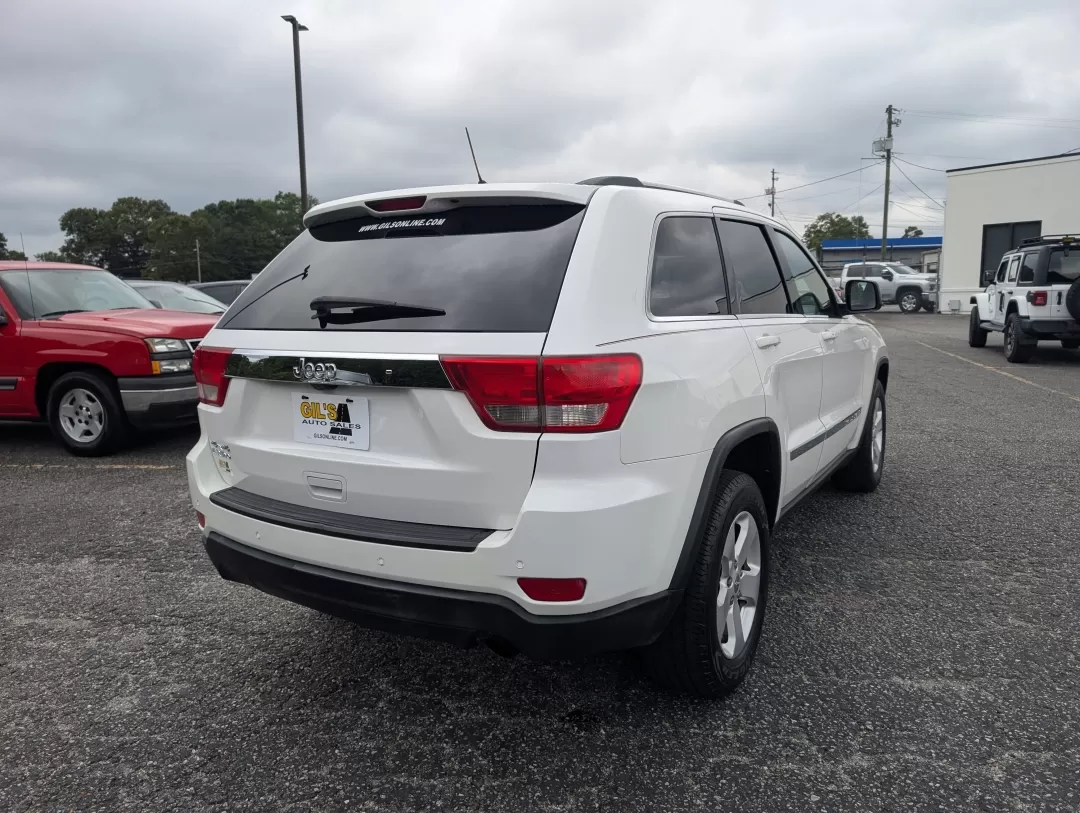 2013 /Black Jeep Grand Cherokee Laredo (1C4RJFAG6DC) with an Other engine, located at 3959 U.S. 80 W, Phenix City, AL, 36870, (334) 297-4885, 32.469296, -85.135185 - **Experience Adventure with the 2013 Jeep Grand Cherokee Laredo at Gils Auto!**<br /> <br /> Are you ready to elevate your adventures with a vehicle that can handle everything life throws your way? Look no further than the 2013 Jeep Grand Cherokee Laredo, available now at Gils Auto in Phenix City, A - Photo#4