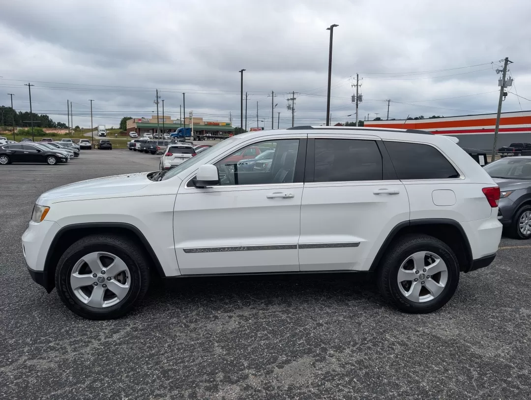 2013 /Black Jeep Grand Cherokee Laredo (1C4RJFAG6DC) with an Other engine, located at 3959 U.S. 80 W, Phenix City, AL, 36870, (334) 297-4885, 32.469296, -85.135185 - **Experience Adventure with the 2013 Jeep Grand Cherokee Laredo at Gils Auto!**<br /> <br /> Are you ready to elevate your adventures with a vehicle that can handle everything life throws your way? Look no further than the 2013 Jeep Grand Cherokee Laredo, available now at Gils Auto in Phenix City, A - Photo#7