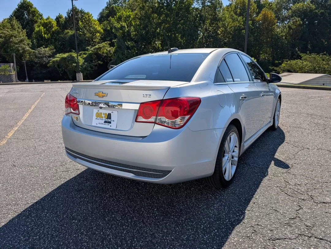 2015 /Jet Black Chevrolet Cruze LTZ (1G1PG5SB8F7) with an Other engine, located at 3959 U.S. 80 W, Phenix City, AL, 36870, (334) 297-4885, 32.469296, -85.135185 - **Discover Unmatched Style and Comfort with the 2015 Chevrolet Cruze LTZ at Gils Auto!**<br /> <br /> Are you in search of a reliable vehicle that fits seamlessly into your daily life? The 2015 Chevrolet Cruze LTZ is the perfect sedan for anyone seeking a stylish ride that excels in efficiency and c - Photo#4