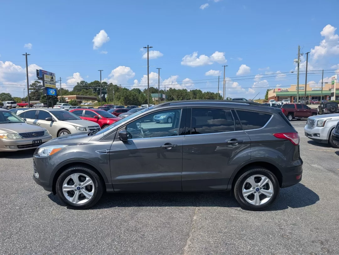 2016 Ford Escape SE (1FMCU0GX0GU) with an Other engine, located at 3959 U.S. 80 W, Phenix City, AL, 36870, (334) 297-4885, 32.469296, -85.135185 - Are you ready to elevate your daily commute or embark on weekend adventures without breaking the bank? Look no further than this 2016 Ford Escape SE, now available at Gils Auto in Phenix City, AL! This stylish sport utility vehicle is perfect for anyone seeking a reliable ride that marries comfort, - Photo#7
