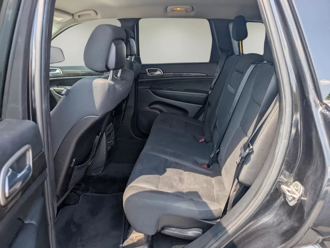 2013 /Black Jeep Grand Cherokee Laredo (1C4RJFAG5DC) with an Other engine, located at 804 22nd Ave, Phenix City, AL, 36870, (334) 297-1860, 32.484749, -85.024475 - Discover adventure and comfort with this versatile 2013 Jeep Grand Cherokee Laredo, perfect for families on the go or anyone seeking an exhilarating weekend escape. This Sport Utility Vehicle (SUV) effortlessly combines rugged performance with modern conveniences, making it an ideal choice for navig - Photo#10