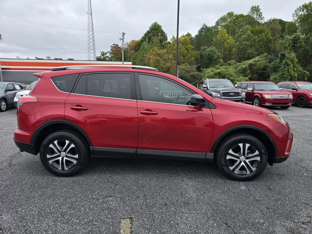 2017 Toyota RAV4 LE (2T3ZFREV7HW) with an Other engine, located at 3959 U.S. 80 W, Phenix City, AL, 36870, (334) 297-4885, 32.469296, -85.135185 - Are you ready to elevate your daily commute or embark on weekend adventures with the perfect SUV? Look no further than this stunning 2017 Toyota RAV4 LE, available now at Gils Auto in Phenix City, AL. Designed for both comfort and versatility, this dynamic vehicle is ideal for growing families, budg - Photo#3