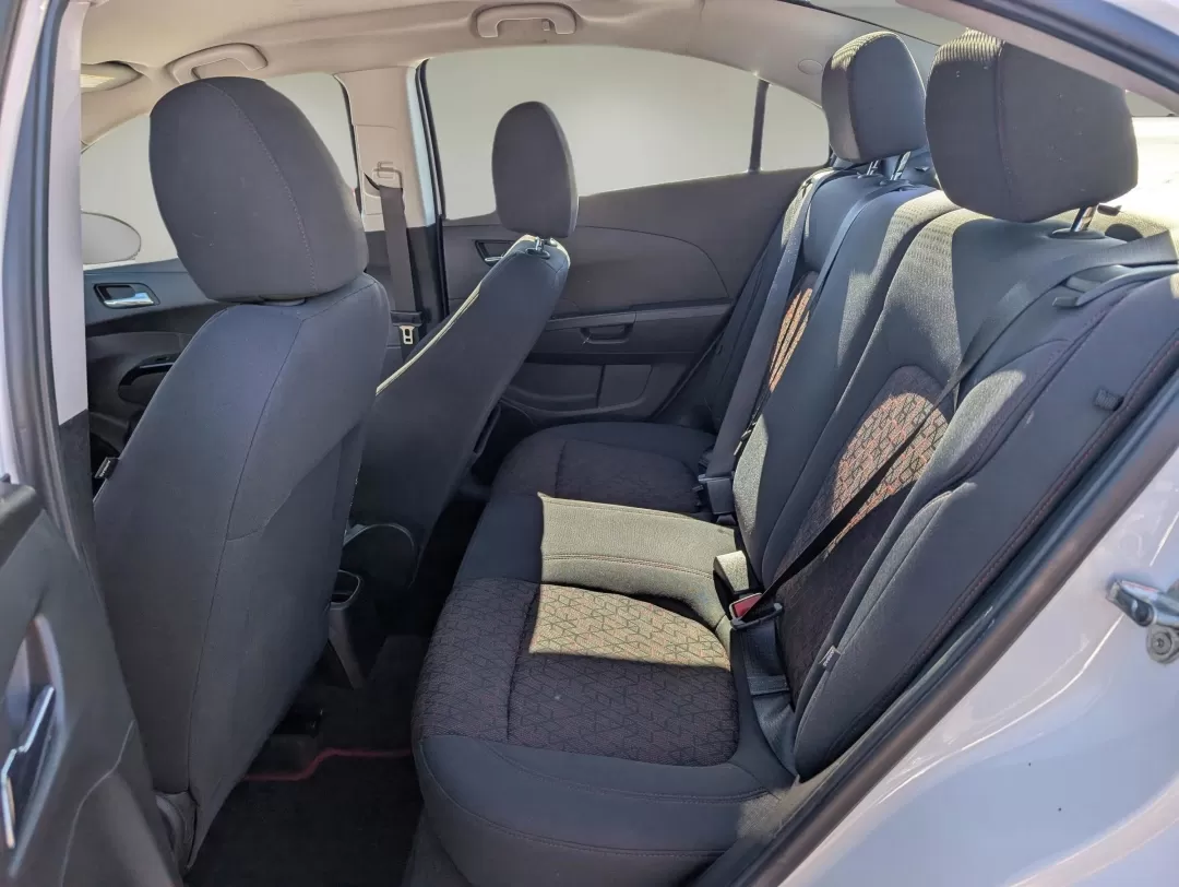 2018 /Jet Black Chevrolet Sonic LT (1G1JD5SHXJ4) with an Other engine, located at 3959 U.S. 80 W, Phenix City, AL, 36870, (334) 297-4885, 32.469296, -85.135185 - **Discover Your Perfect Commute Companion: 2018 Chevrolet Sonic LT at Gils Auto, Phenix City**<br /> <br /> Are you ready to elevate your daily drive? The 2018 Chevrolet Sonic LT is the ideal choice for those who crave a reliable, fuel-efficient sedan that doesn't compromise on style or features. Wh - Photo#10