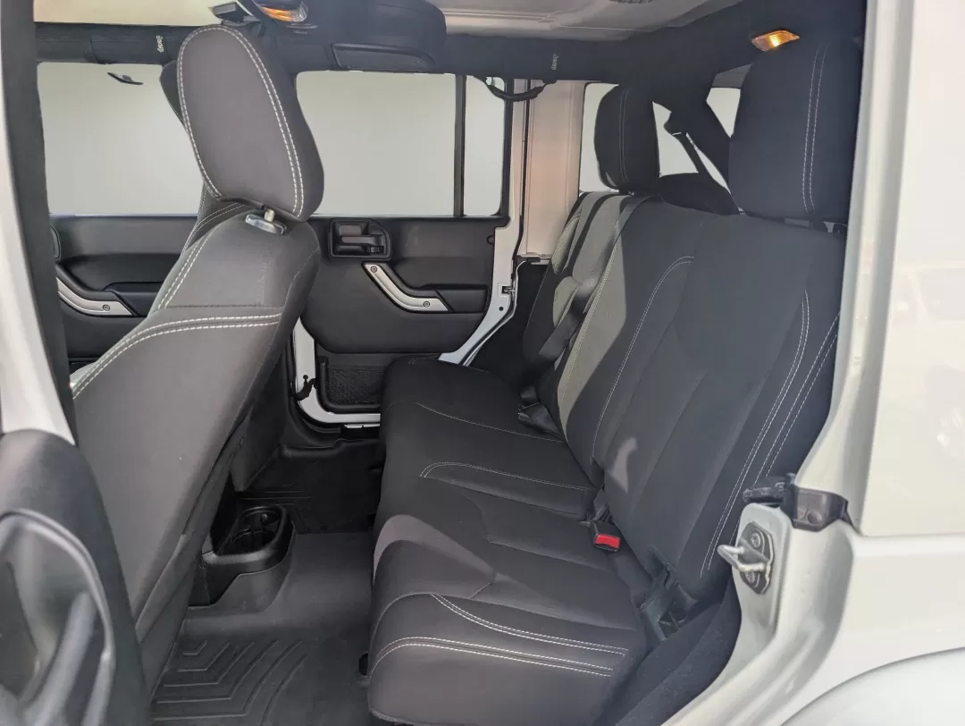 2018 /Black Jeep Wrangler Sahara (1C4BJWEG4JL) with an Other engine, located at 7000 Northlake Connector, Columbus, GA, 31904, (706) 987-8085, 32.524975, -84.978134 - **Adventure Awaits: 2018 Jeep Wrangler Sahara at Gils Auto**<br /> <br /> Are you ready to embark on your next adventure? Whether you're planning a weekend getaway to the stunning landscapes of Lake Martin or navigating through the vibrant streets of Phenix City, this 2018 Jeep Wrangler Sahara is yo - Photo#10