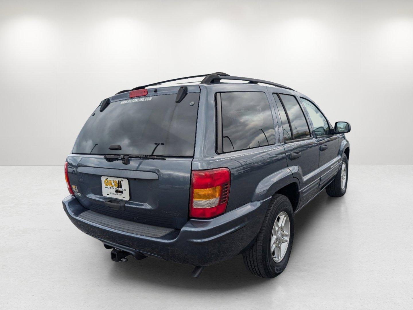 2004 Steel Blue Pearl /Dark Slate Gray Jeep Grand Cherokee Laredo (1J4GX48S34C) with an Gas I6 4.0L/242 engine, 4-Speed Automatic w/OD transmission, located at 1430 Gateway Drive, Opelika, AL, 36801, (334) 239-0944, 32.637871, -85.409790 - 2004 Jeep Grand Cherokee Laredo - Photo#4