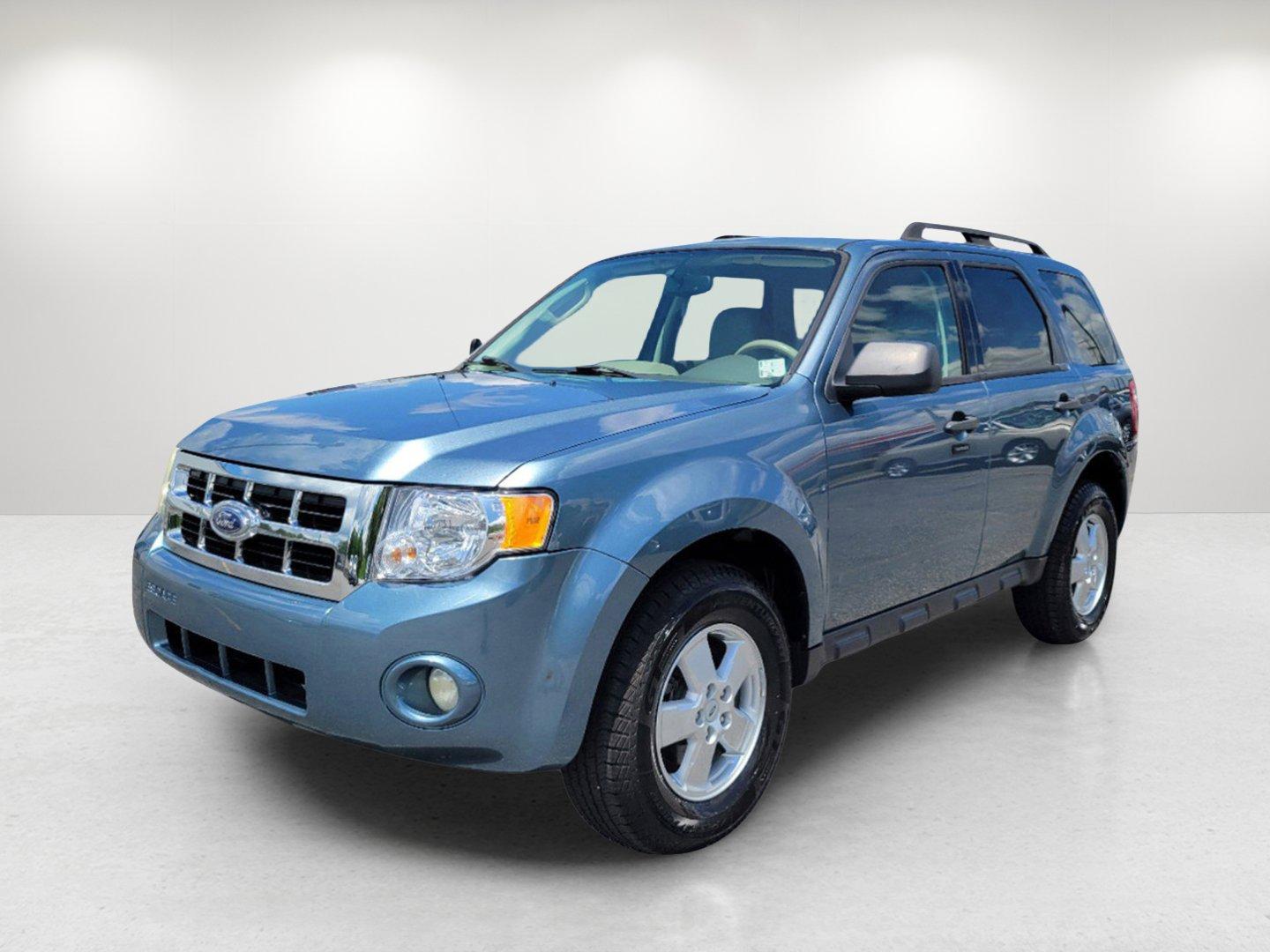 2011 Blue Ford Escape XLT (1FMCU0D73BK) with an Gas I4 2.5L/152 engine, 6-Speed Automatic transmission, located at 1430 Gateway Drive, Opelika, AL, 36801, (334) 239-0944, 32.637871, -85.409790 - 2011 Ford Escape XLT - Photo#0