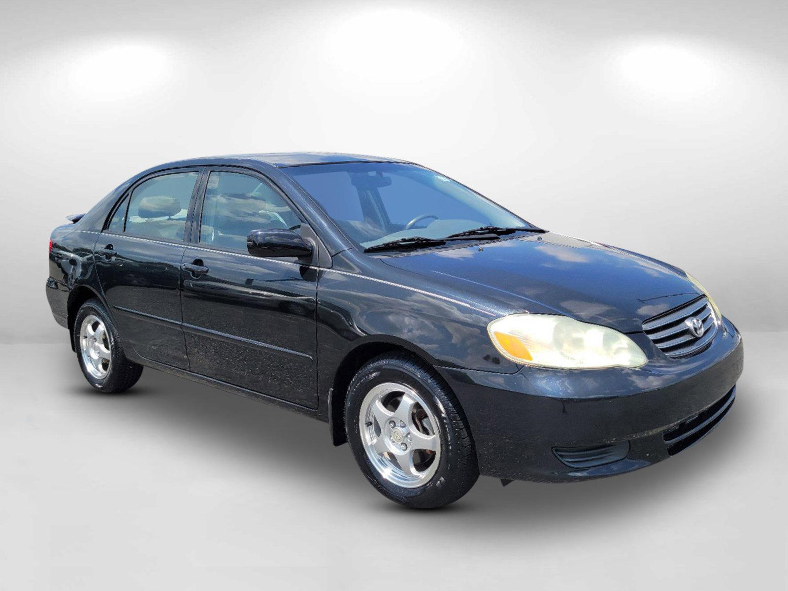 2003 Black /Gray Toyota Corolla LE (JTDBR32E730) with an Gas I4 1.8L/108 engine, 4-Speed Automatic w/OD transmission, located at 1430 Gateway Drive, Opelika, AL, 36801, (334) 239-0944, 32.637871, -85.409790 - 2003 Toyota Corolla LE - Photo#2