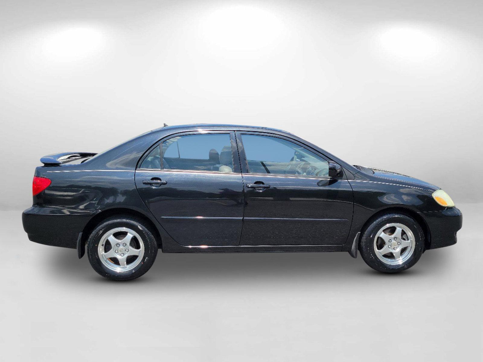 2003 Black /Gray Toyota Corolla LE (JTDBR32E730) with an Gas I4 1.8L/108 engine, 4-Speed Automatic w/OD transmission, located at 3959 U.S. 80 W, Phenix City, AL, 36870, (334) 297-4885, 32.469296, -85.135185 - 2003 Toyota Corolla LE - Photo#3