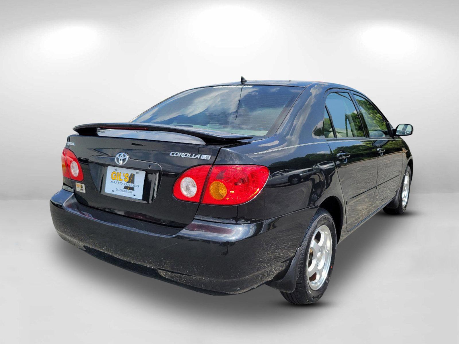 2003 Black /Gray Toyota Corolla LE (JTDBR32E730) with an Gas I4 1.8L/108 engine, 4-Speed Automatic w/OD transmission, located at 3959 U.S. 80 W, Phenix City, AL, 36870, (334) 297-4885, 32.469296, -85.135185 - 2003 Toyota Corolla LE - Photo#4