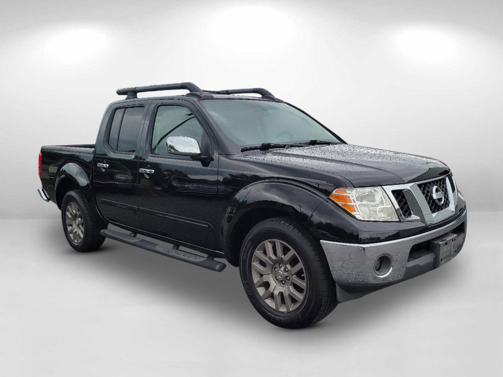 2010 Super Black /Graphite Nissan Frontier LE (1N6AD0ER7AC) with an Gas V6 4.0L/ engine, 5-Speed Automatic w/OD transmission, located at 3959 U.S. 80 W, Phenix City, AL, 36870, (334) 297-4885, 32.469296, -85.135185 - 2010 Nissan Frontier LE - Photo#2