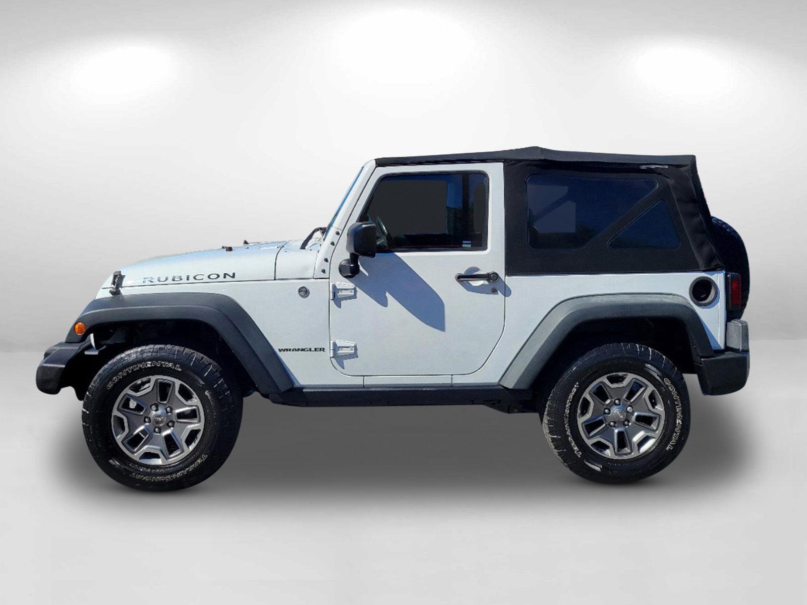 2015 Bright White Clearcoat /Black Jeep Wrangler Rubicon (1C4BJWCG4FL) with an Regular Unleaded V-6 3.6 L/220 engine, 5-Speed Automatic w/OD transmission, located at 804 22nd Ave, Phenix City, AL, 36870, (334) 297-1860, 32.484749, -85.024475 - 2015 Jeep Wrangler Rubicon - Photo#7