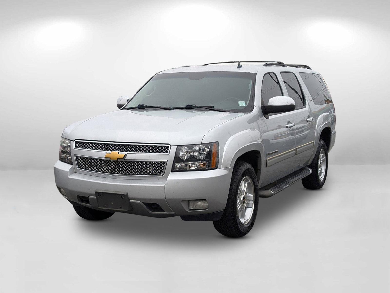 2013 /Ebony Chevrolet Suburban LT (1GNSKJE77DR) with an Gas/Ethanol V8 5.3L/323 engine, 6-Speed Automatic transmission, located at 1430 Gateway Drive, Opelika, AL, 36801, (334) 239-0944, 32.637871, -85.409790 - 2013 Chevrolet Suburban LT - Photo#1