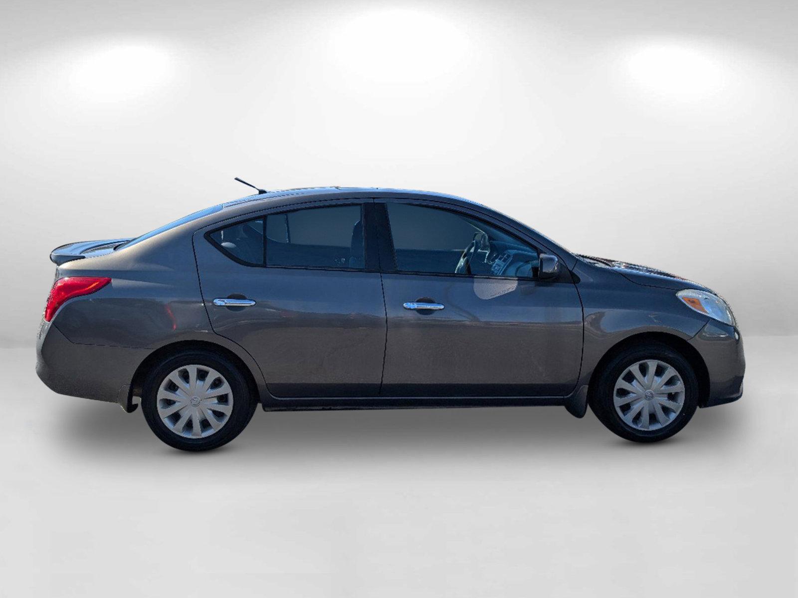 2014 /Charcoal Nissan Versa SV (3N1CN7AP9EL) with an Regular Unleaded I-4 1.6 L/98 engine, 1-Speed CVT w/OD transmission, located at 1430 Gateway Drive, Opelika, AL, 36801, (334) 239-0944, 32.637871, -85.409790 - 2014 Nissan Versa SV - Photo#3