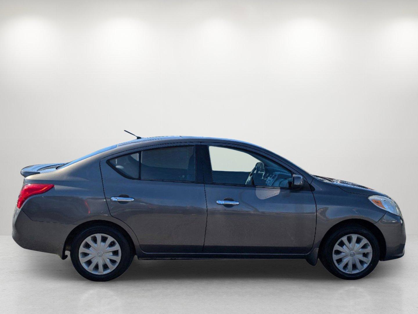 2014 /Charcoal Nissan Versa SV (3N1CN7AP9EL) with an Regular Unleaded I-4 1.6 L/98 engine, 1-Speed CVT w/OD transmission, located at 804 22nd Ave, Phenix City, AL, 36870, (334) 297-1860, 32.484749, -85.024475 - 2014 Nissan Versa SV - Photo#3