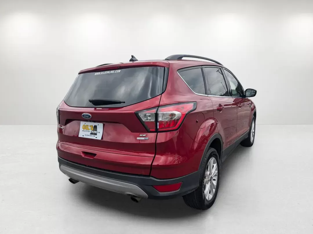 2018 Red Ford Escape SE (1FMCU9GD1JU) with an Intercooled Turbo Regular Unleaded I-4 1.5 L/91 engine, 6-Speed Automatic w/OD transmission, located at 3959 U.S. 80 W, Phenix City, AL, 36870, (334) 297-4885, 32.469296, -85.135185 - 2018 Ford Escape SE - Photo#5