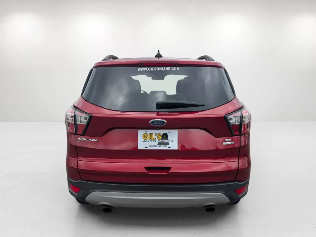 2018 Red Ford Escape SE (1FMCU9GD1JU) with an Intercooled Turbo Regular Unleaded I-4 1.5 L/91 engine, 6-Speed Automatic w/OD transmission, located at 3959 U.S. 80 W, Phenix City, AL, 36870, (334) 297-4885, 32.469296, -85.135185 - 2018 Ford Escape SE - Photo#6