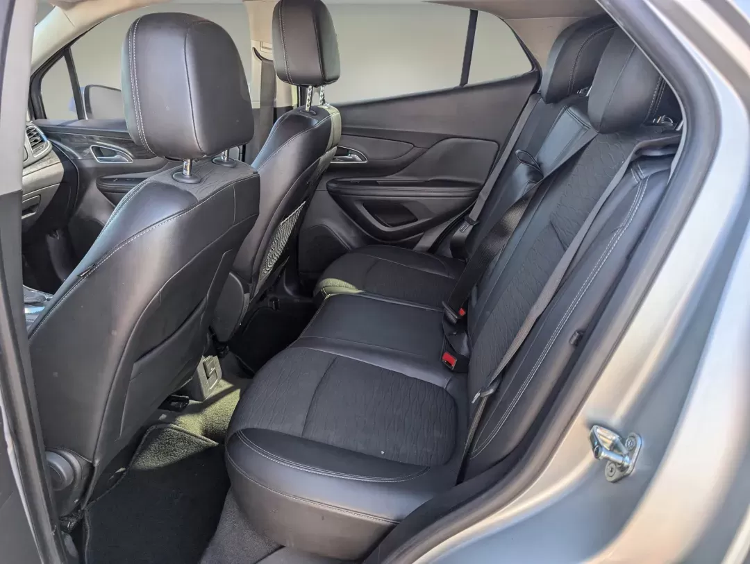 2015 /Ebony Buick Encore Convenience (KL4CJBSB8FB) with an Turbocharged I4 1.4/83 engine, 6-Speed Automatic transmission, located at 804 22nd Ave, Phenix City, AL, 36870, (334) 297-1860, 32.484749, -85.024475 - 2015 Buick Encore Convenience - Photo#11