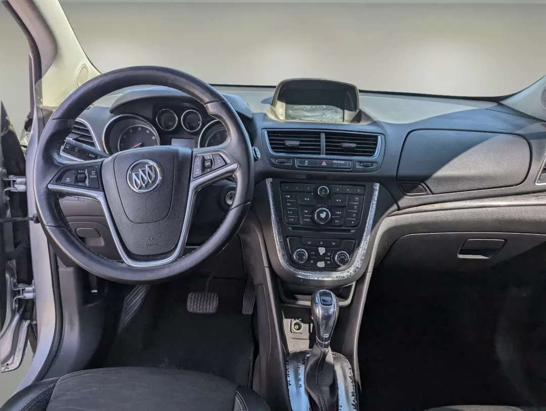 2015 /Ebony Buick Encore Convenience (KL4CJBSB8FB) with an Turbocharged I4 1.4/83 engine, 6-Speed Automatic transmission, located at 804 22nd Ave, Phenix City, AL, 36870, (334) 297-1860, 32.484749, -85.024475 - 2015 Buick Encore Convenience - Photo#12